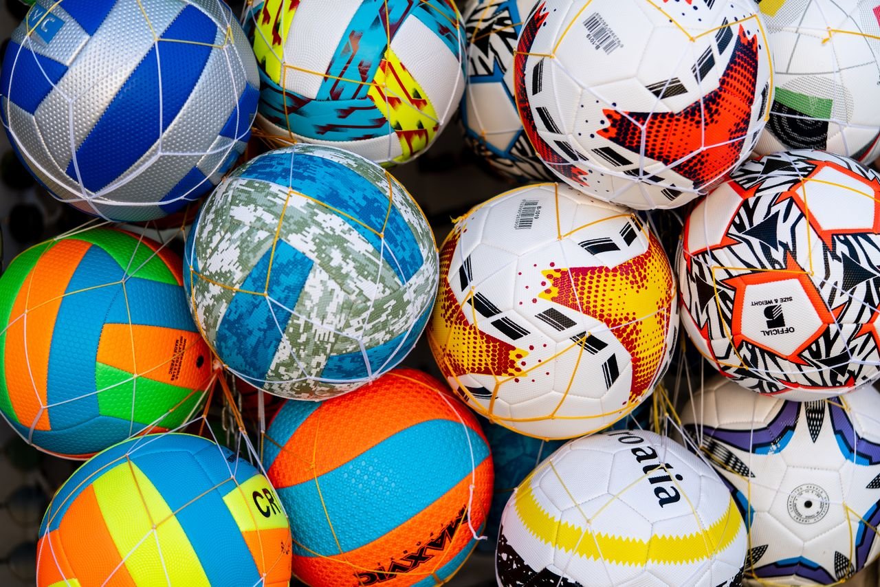 Mastering the First Impression: Your intriguing post title goes here Vibrant collection of soccer balls with various patterns and colors.