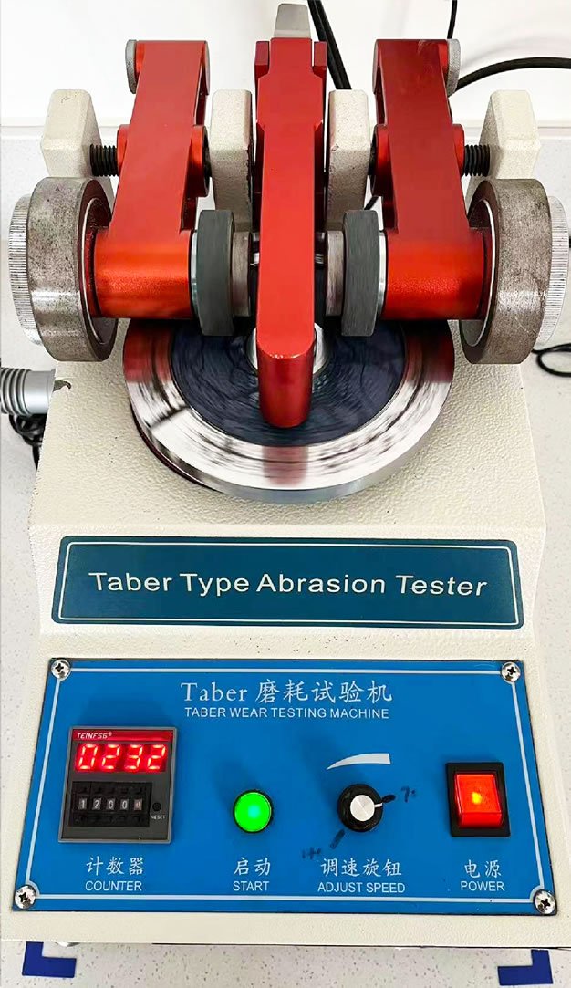 Haimi Sports — B2B Sports Balls Supply Taber abrasion tester used to evaluate surface wear resistance